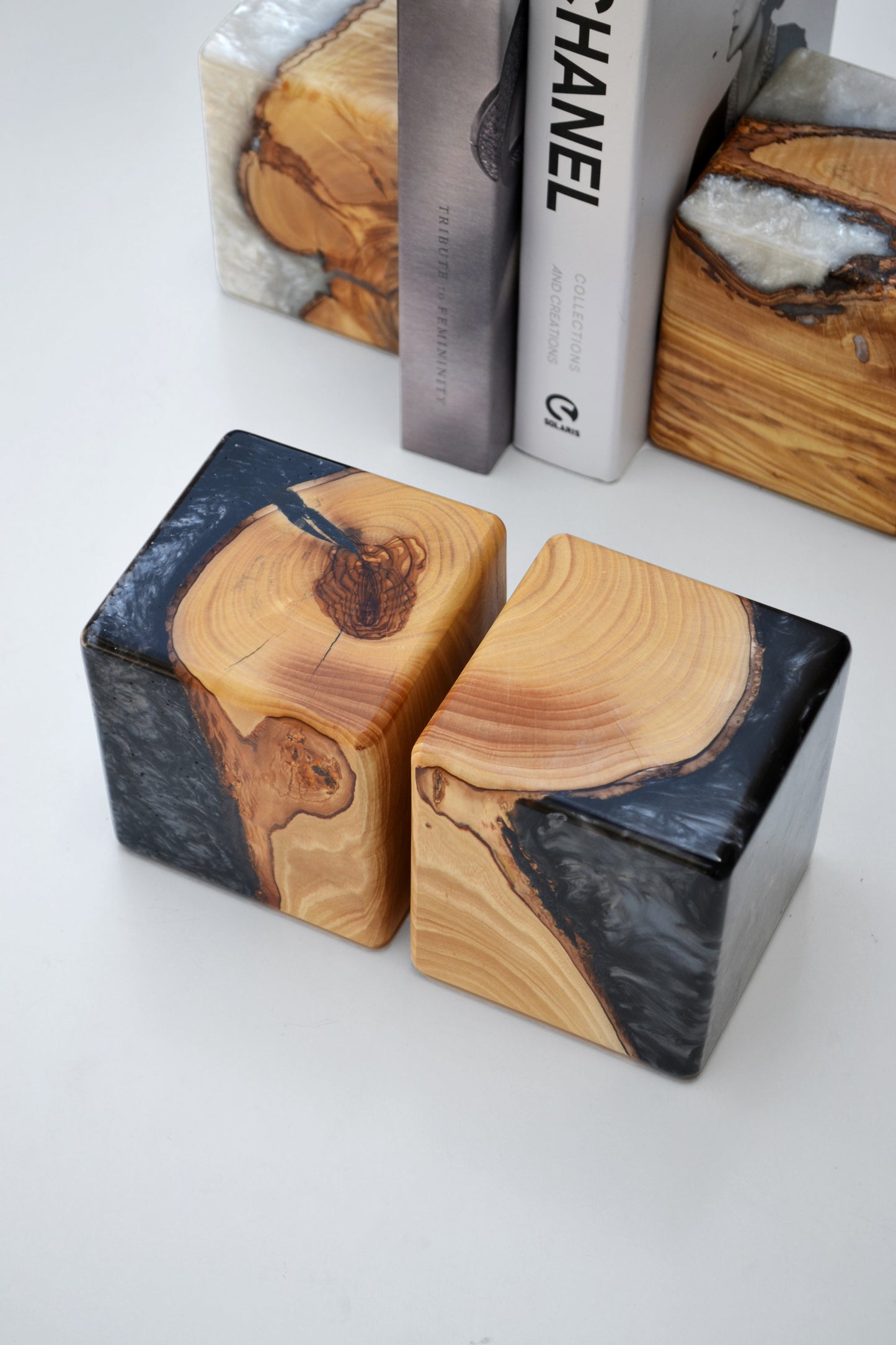 Artful olive tree lifecycle bookends, preserved in resin to showcase warm organic wood grain. Ideal for book lovers at home or in the office