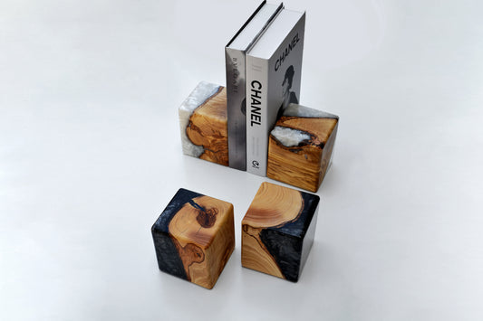 Artful olive tree lifecycle bookends, preserved in resin to showcase warm organic wood grain. Ideal for book lovers at home or in the office