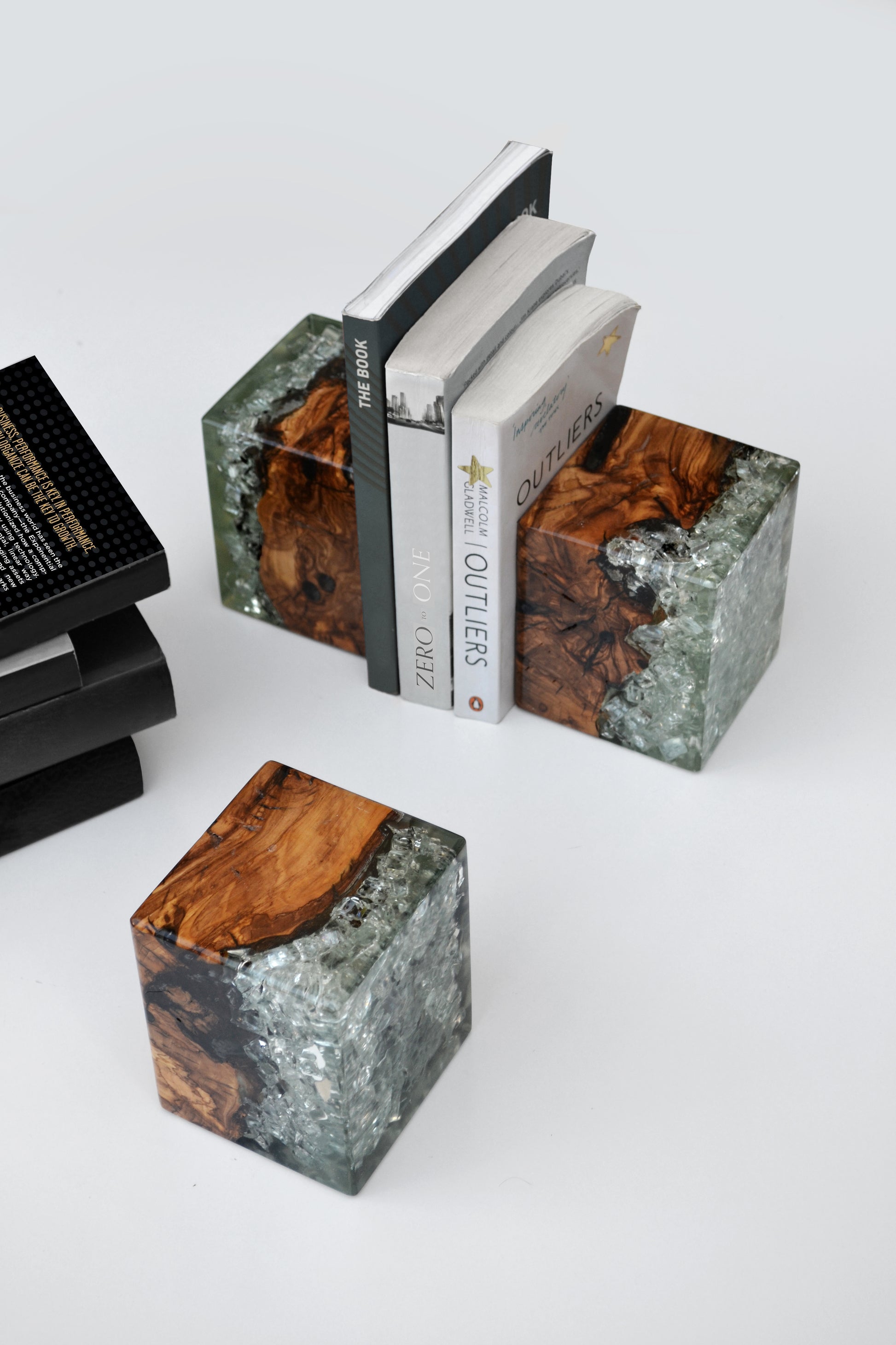 Artful olive tree lifecycle bookends, preserved in resin to showcase warm organic wood grain. Ideal for book lovers at home or in the office